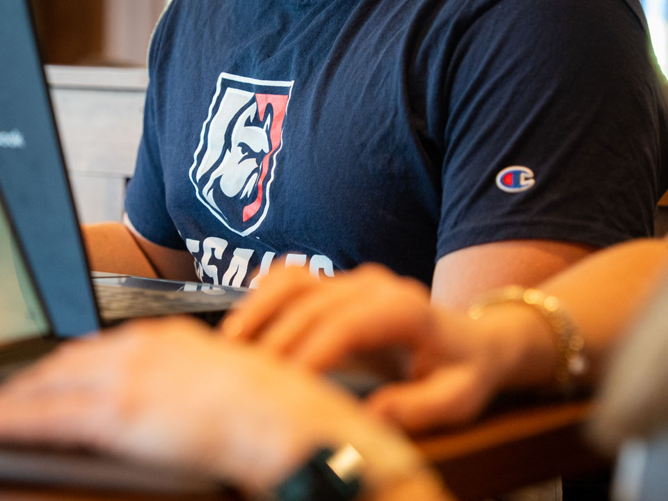 close up of desales logo on shirt