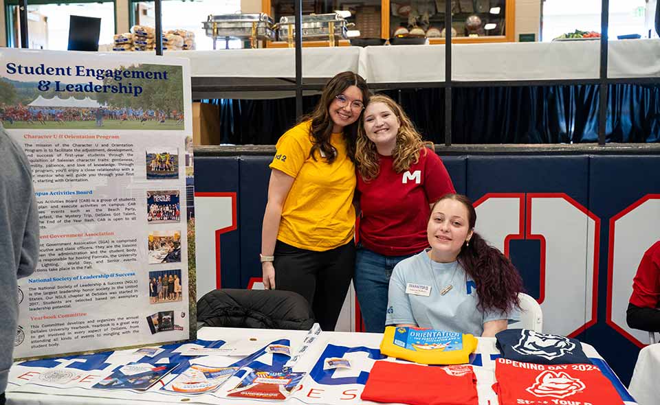 students at an information table
