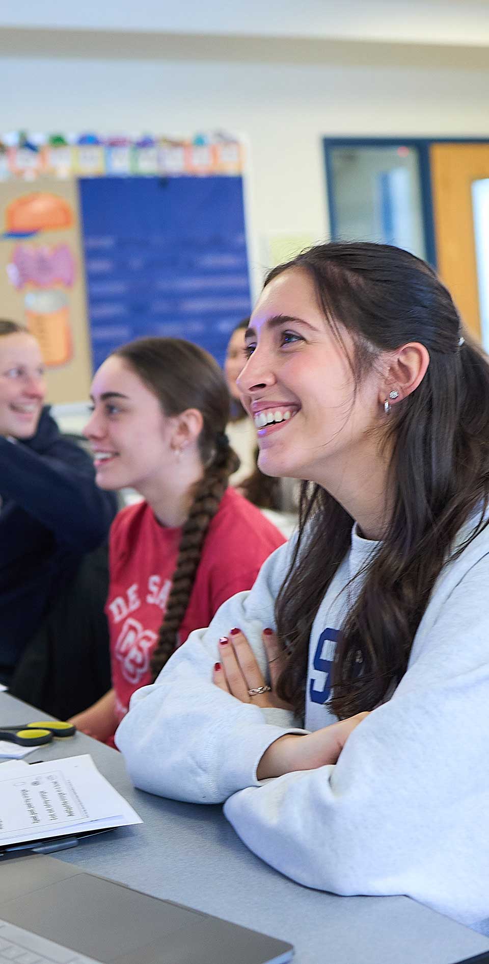 female students smiling in a classroom