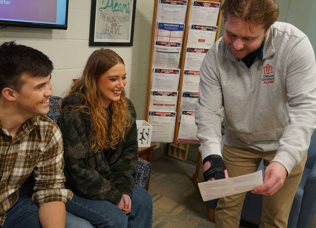 students networking with an alumni