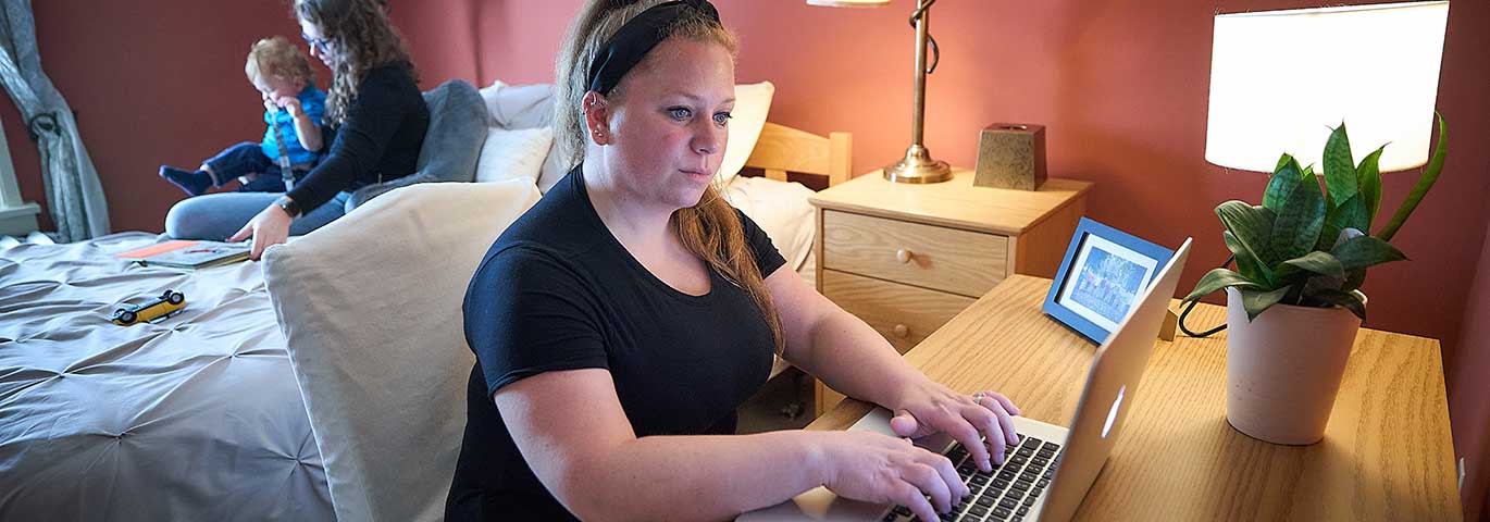 woman using laptop at home